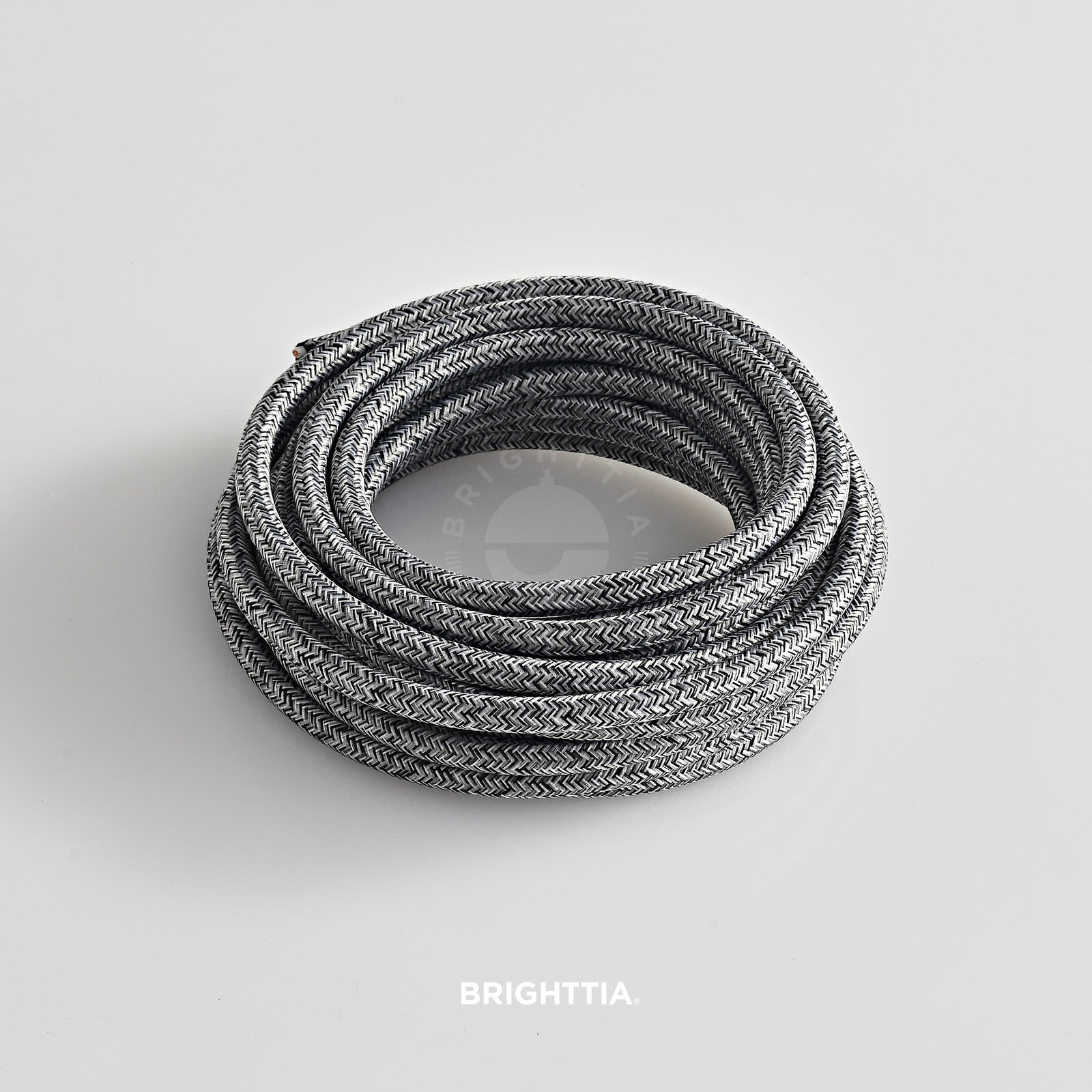 A roll of solid round gray mix fabric cord 4.88m (16ft) on a white background
