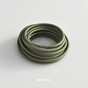 A roll of solid round olive green fabric cord 4.88m (16ft) on a white background