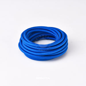 A roll of solid round cobalt blue fabric cord 4.88m (16ft) on a white background