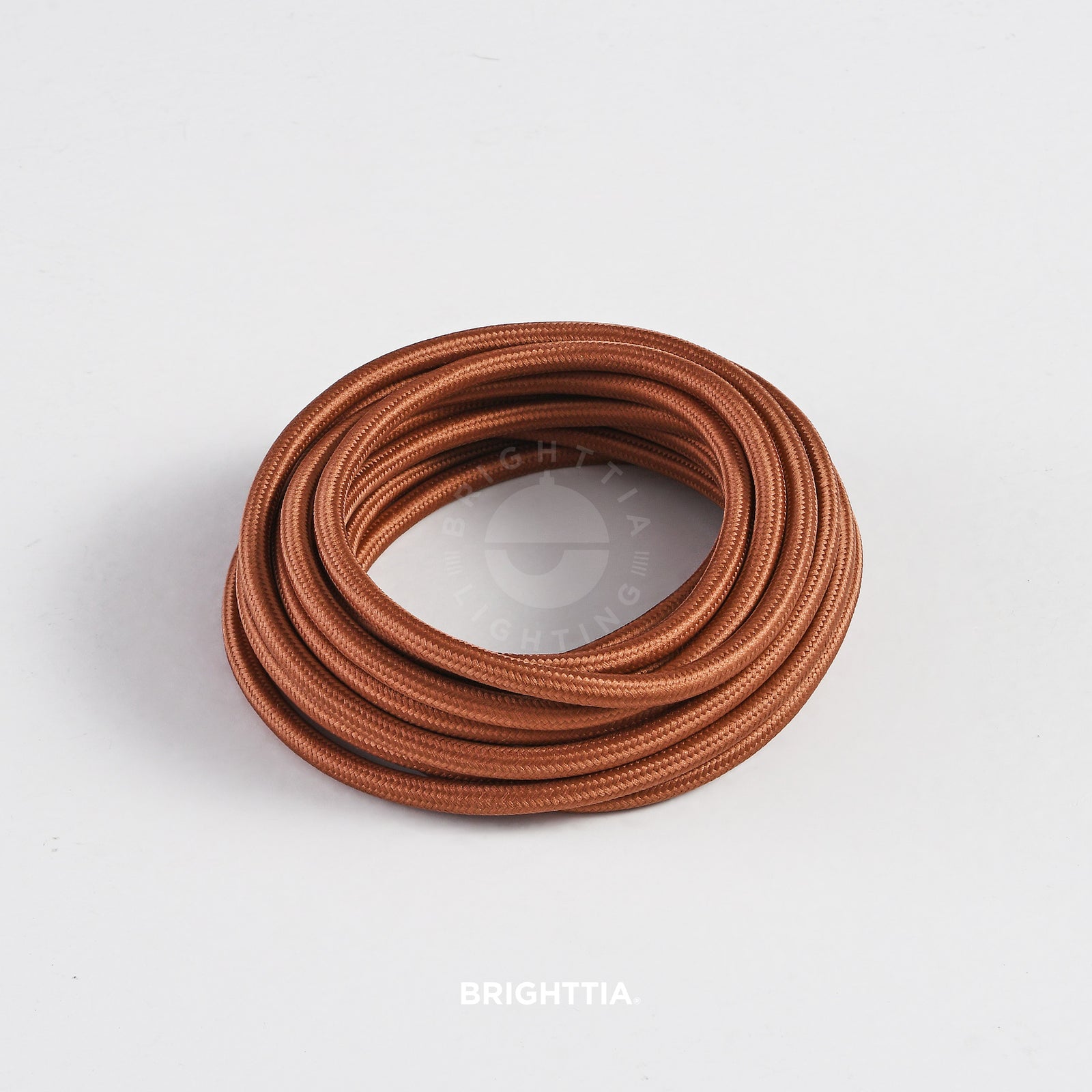 A roll of solid round brown fabric cord 4.88m (16ft) on a white background