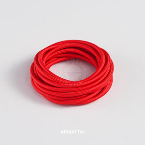 A roll of solid round red fabric cord 4.88m (16ft) on a white background