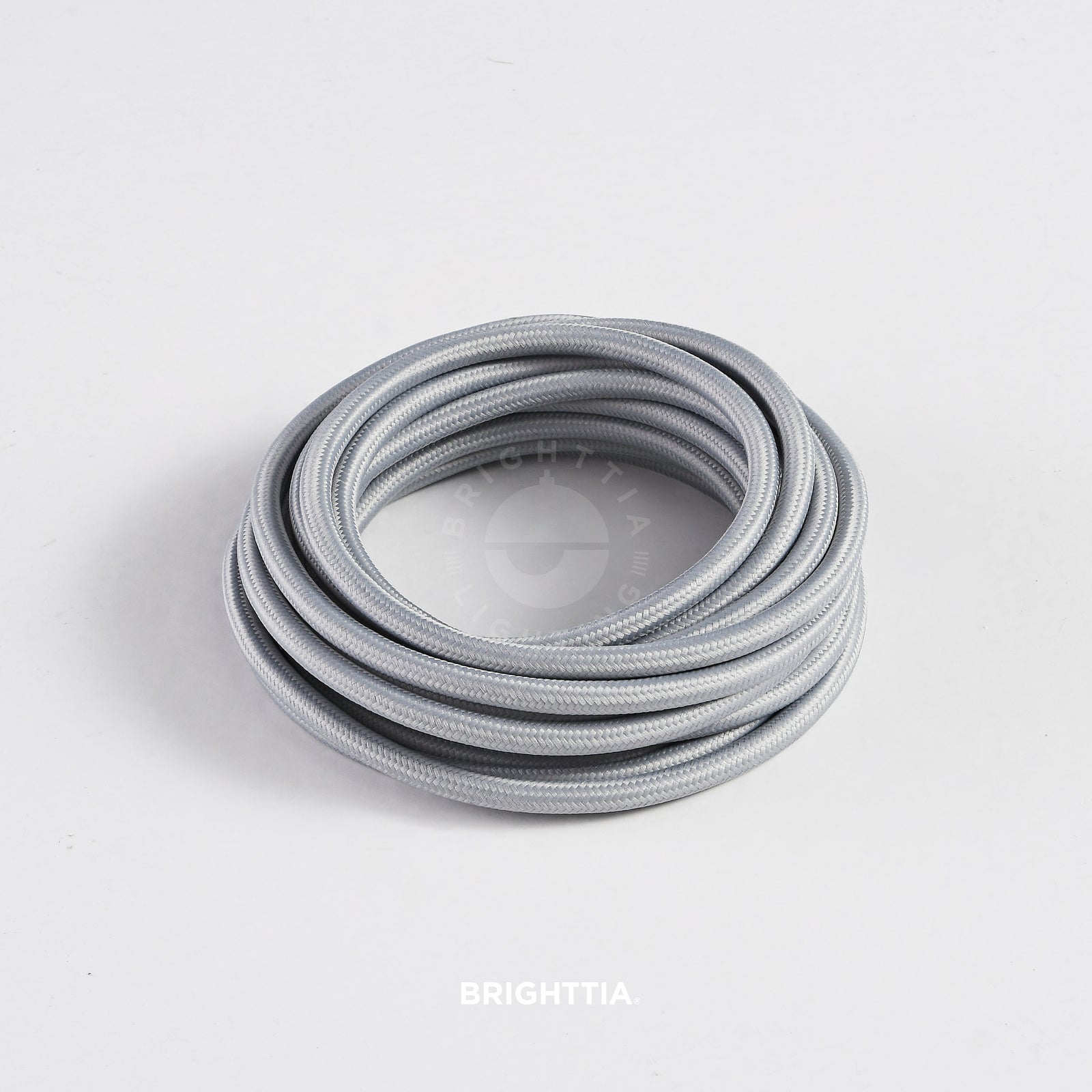 A roll of solid round gray fabric cord 4.88m (16ft) on a white background