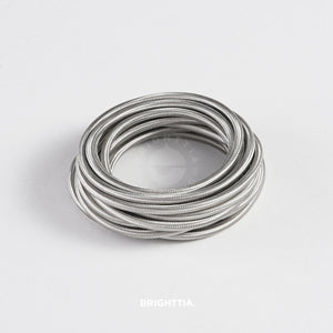 A roll of solid round silver fabric cord 4.88m (16ft) on a white background