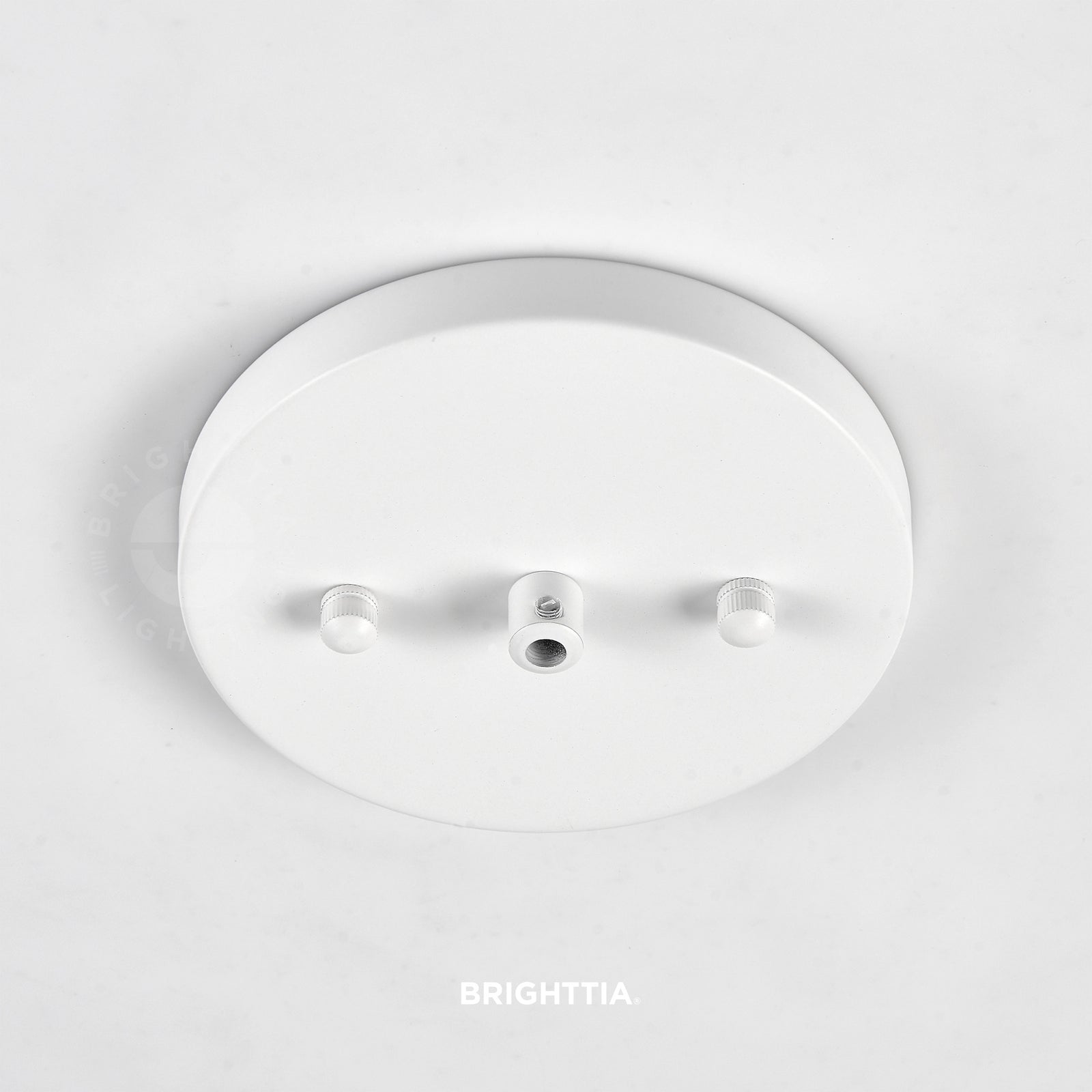 A 5in slim modern 1-port ceiling canopy in white mounted on a white ceiling.