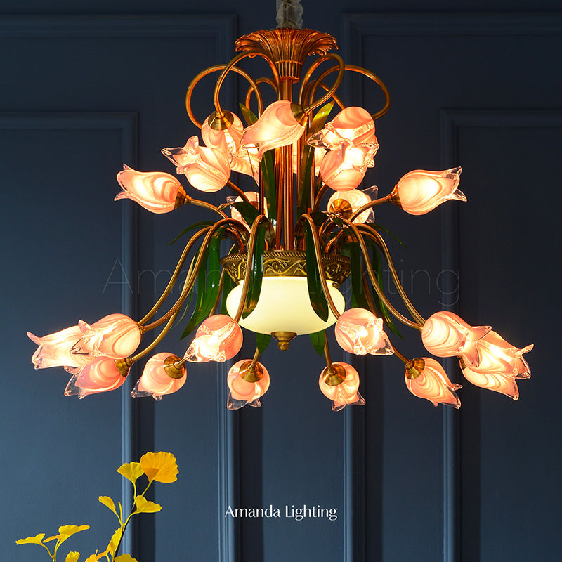 Pink tulip flower chandelier over dining table with a dark navy blue background